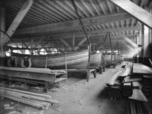Boatbuilder's shed, with planked-up clinker lifeboats, interior