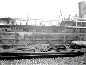 Profile view from dock side of seperated hulls, with newly constructed hull insertion