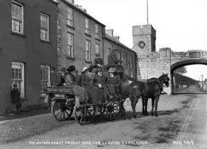 The Antrim Coast Tourist Long Car Leaving Carnlough