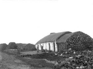 Untitled (a farmyard scene with rope thatched buildings and two ladies standing outside)