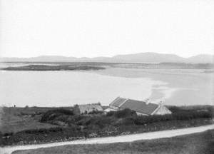 Untitled (an unidentified coastal view, with cottages beside the sea and beach, perhaps Donegal)