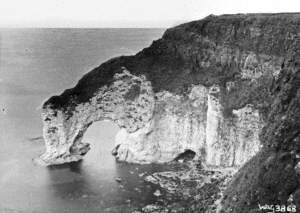 Untitled (an elevated and spectacular view of 'The Wishing Arch', Portrush, an eroded cliff formation)