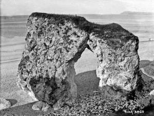 Untitled (a view of a natural arch stump on the beach at Portrush)