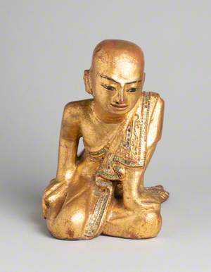 Buddhist Monk Kneeling Forward in Meditation