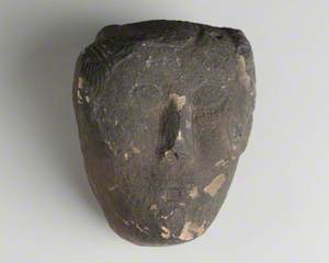 Black Stone Head with Carved Face