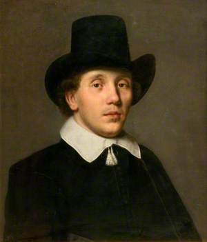 Portrait of a Man in a Black Dress Wearing a Hat