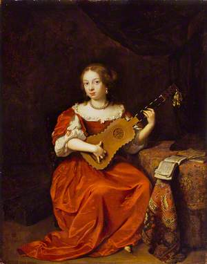 A Young Lady Playing the Guitar