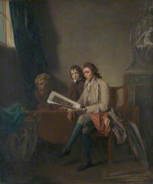 A Man and a Boy Looking at Prints