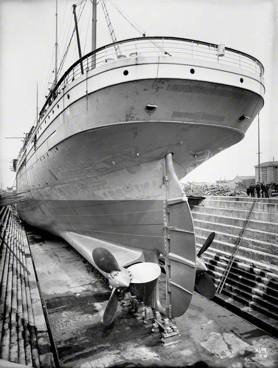 Port stern view in dry dock with plating completed and propellers fitted