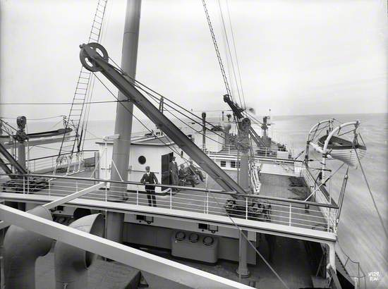 View aft over third class deck and poop deck from second class promenade deck at sea