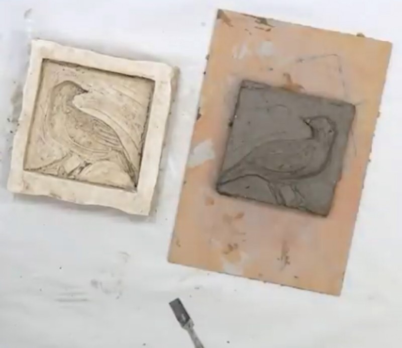A plaster mould and tile with clay tools