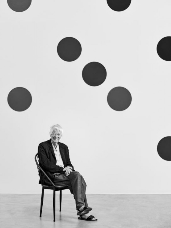 Bridget Riley in front of the wall painting 'Dancing to the Music of Time'