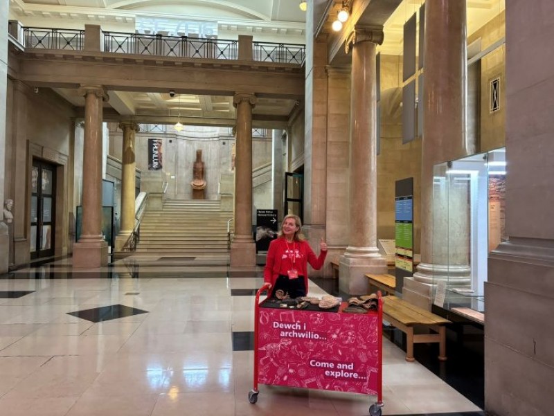 Dr Caroline Lloyd with the Explore trolley at National Museum Cardiff