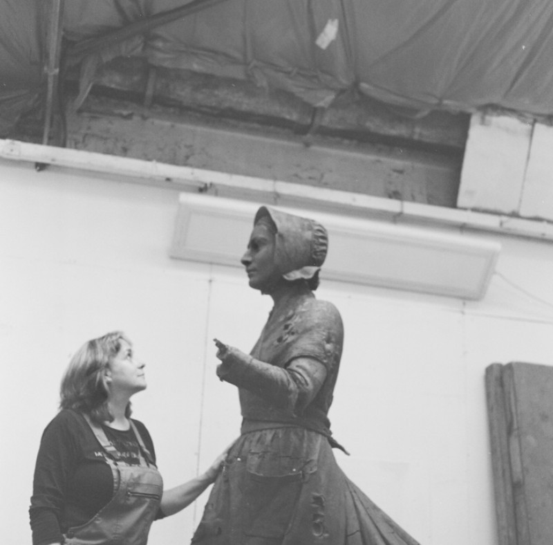 Denise Dutton with the maquette of Mary Anning in her studio