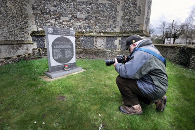 Robert H. Taylor photographing a monument