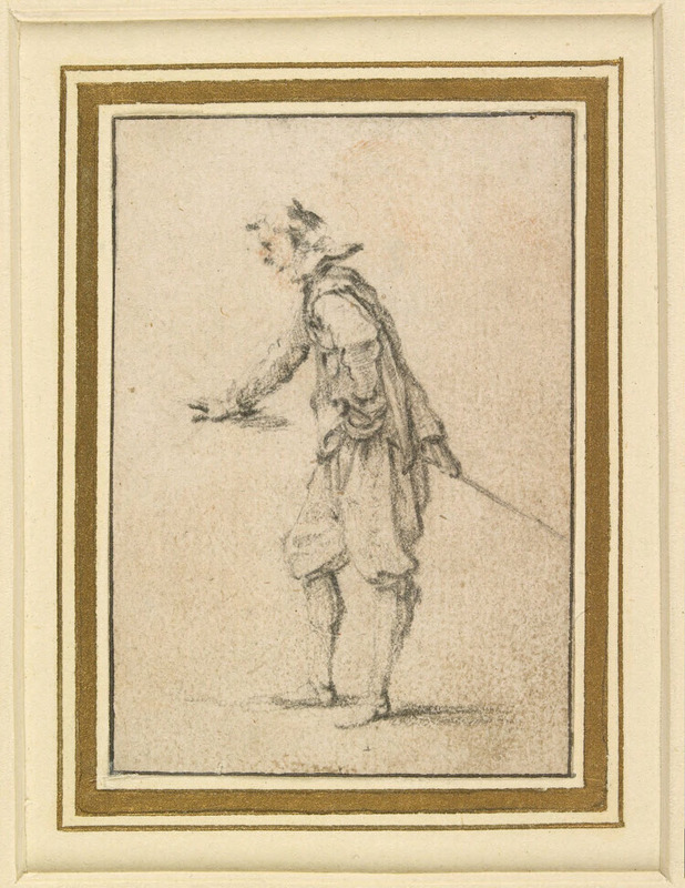 Man holding his right hand forward, as if leaning on a table