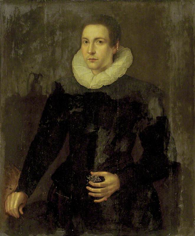 A young Man holding a Jewel