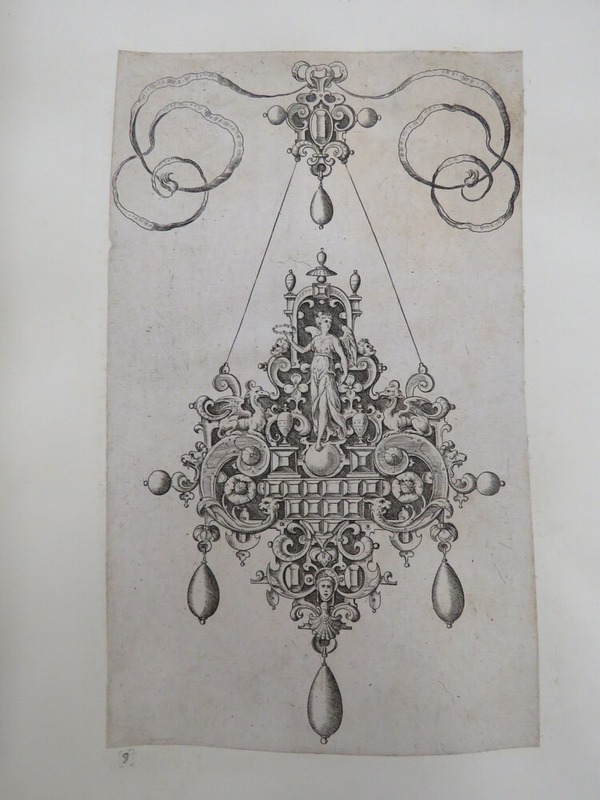 Pendant design with Victory holding a laurel wreath standing on a ball surrounded by grotesque strapwork and inset gems with jewelled ribbon design above, from Douce Ornament Prints Album I
