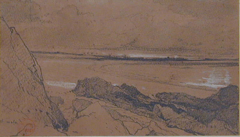 View across a bay with windmills in the distance