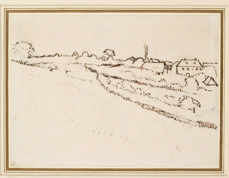 A field with shrubs and buildings on the right