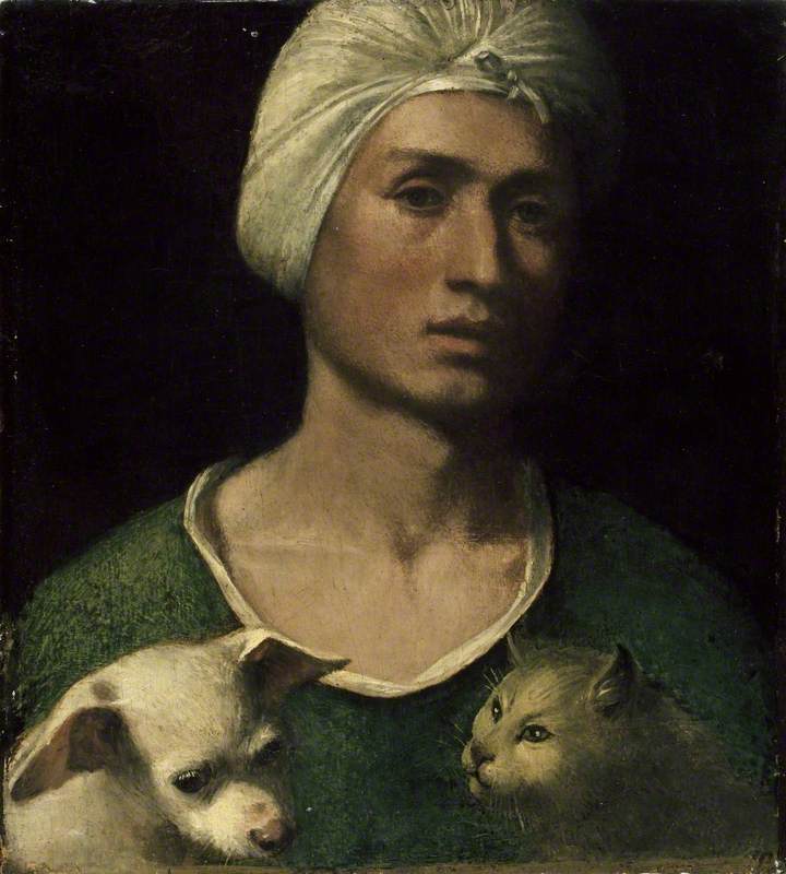 Portrait of a young Man holding a Dog and a Cat