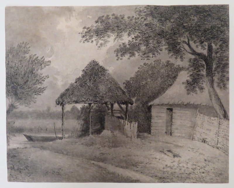 Farm buildings on the edge of a river