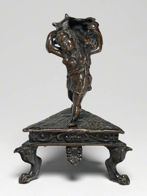 Inkwell Formed as a Running Boy Carrying a Shell