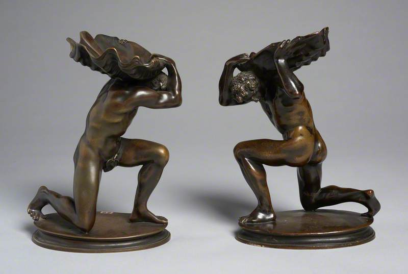 Pair of Kneeling Male Figures Holding Shells