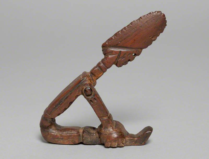 Stylised Figure Seated Bent Over with Arms on Knees