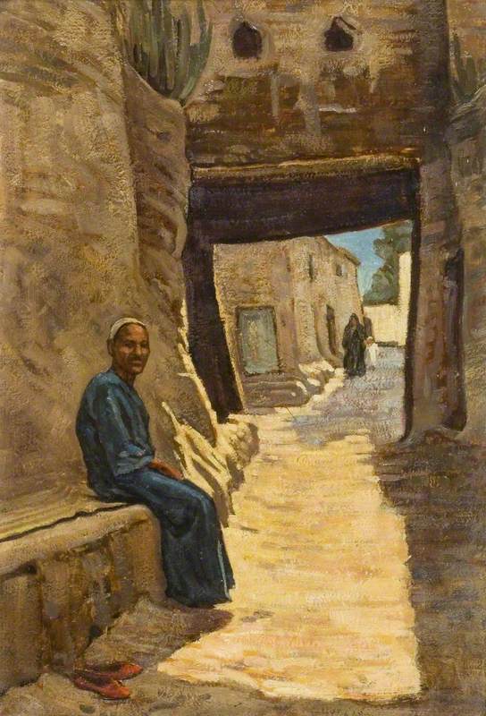 A Man Seated in an Egyptian Village Street