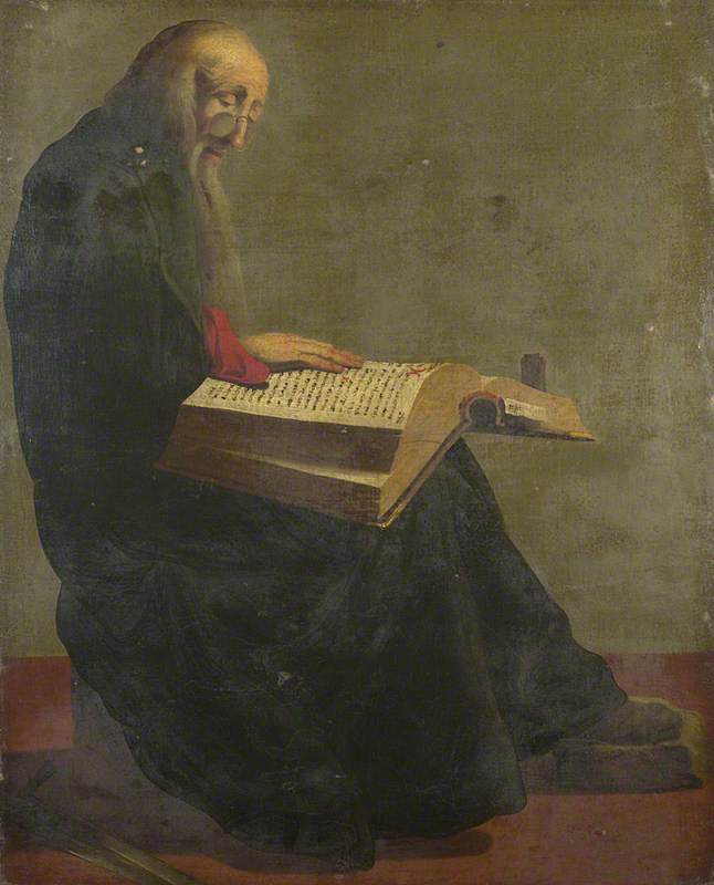 Saint Paul seated reading