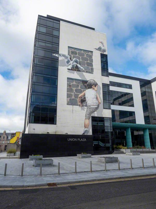 Child Climbing up Building