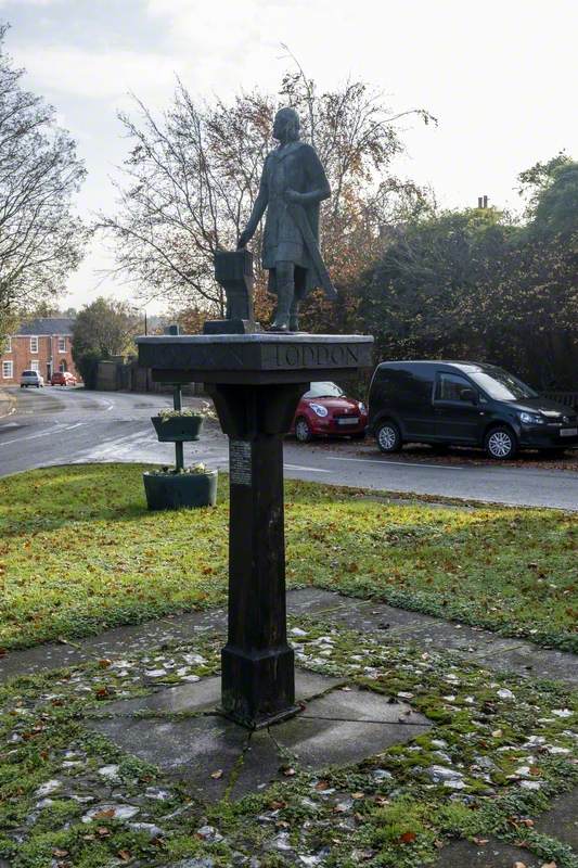 Village Sign with Statue of Aelfric Modercope