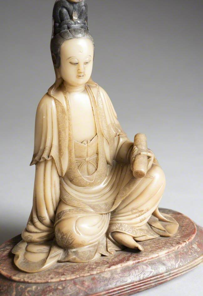 Seated Guanyin Holding a Scroll