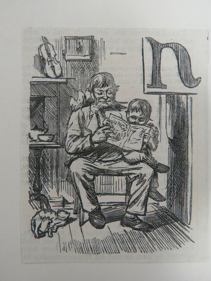Man and child reading a copy of Punch together