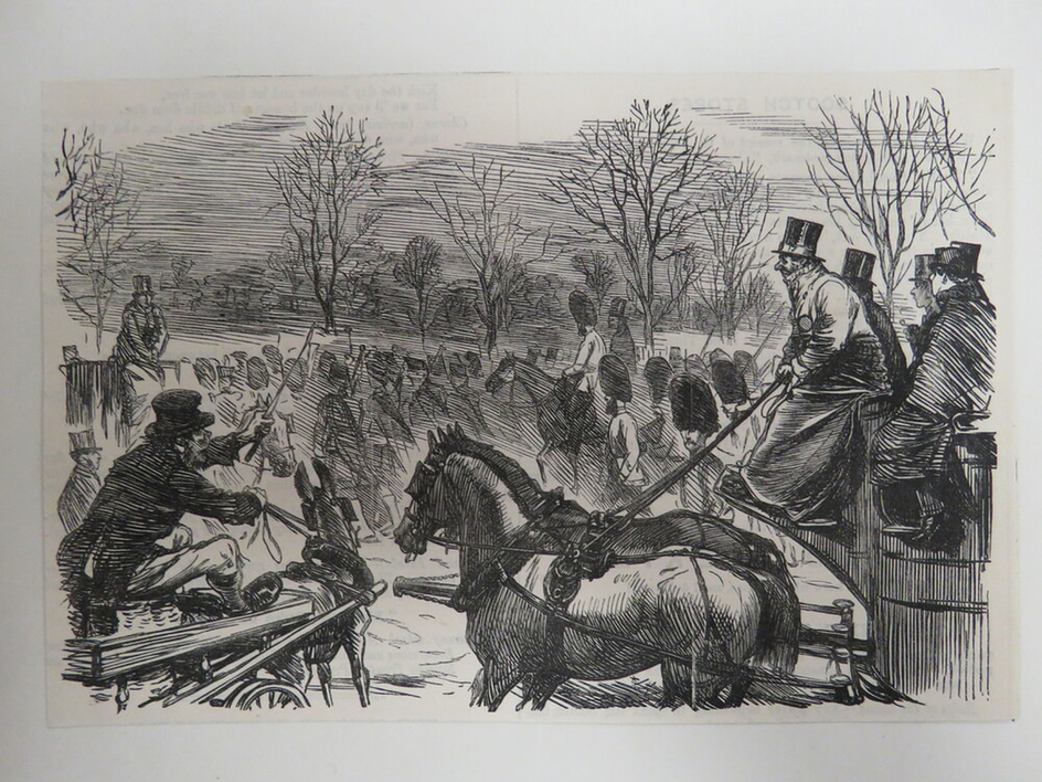 Two horse drawn carriages blocking each other off, with a crowd in the background