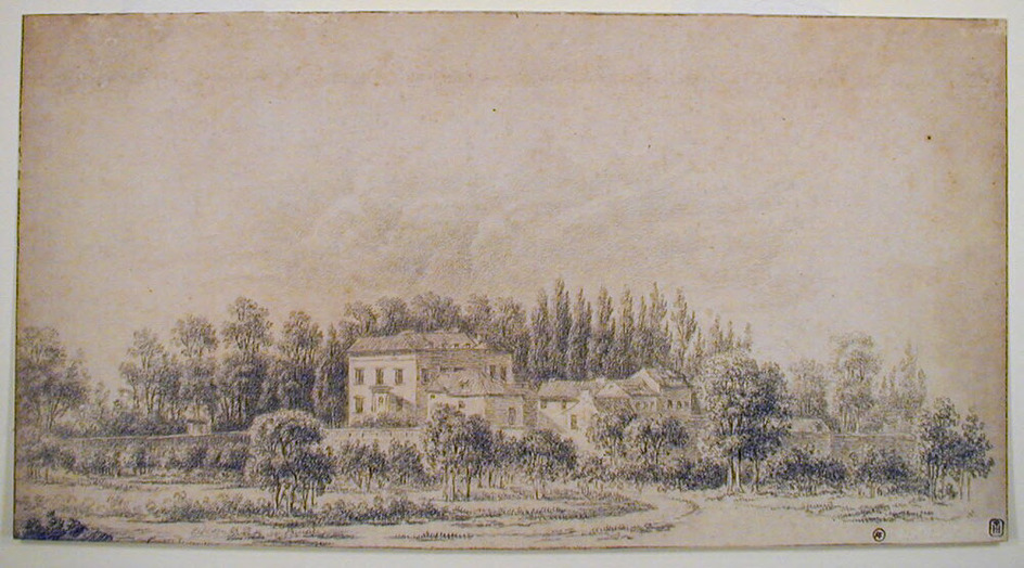 A country house with trees beyond