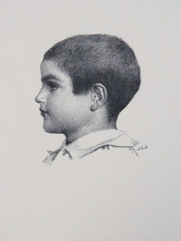 Head of a young boy turned to the left