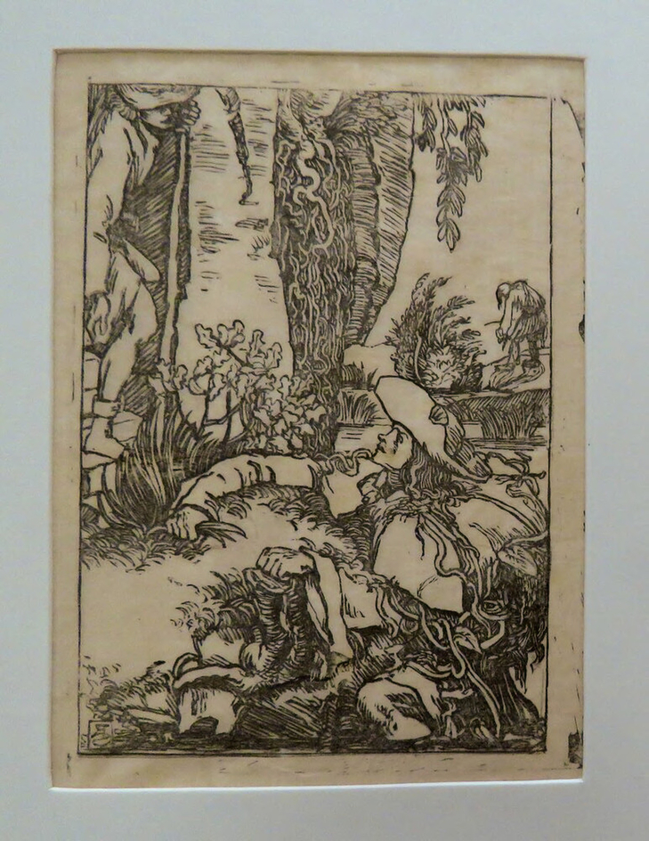 Man climbing the bank of a stream, man on steps, man in background