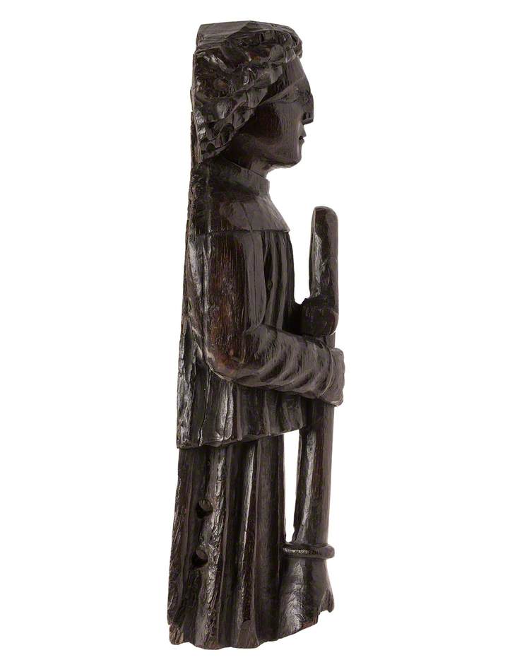 Figure Holding a Wind Instrument*