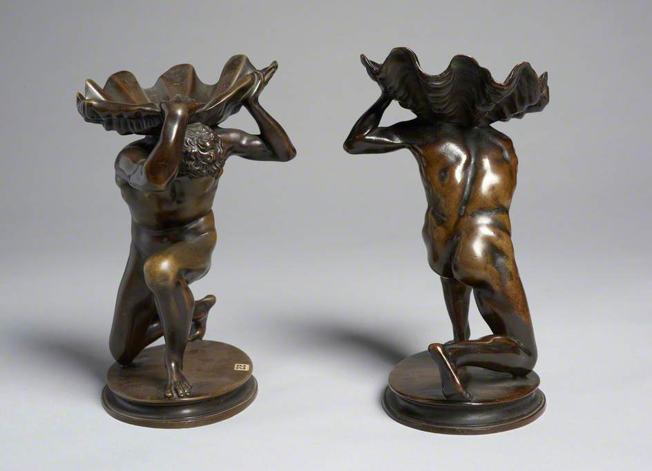 Pair of Kneeling Male Figures Holding Shells