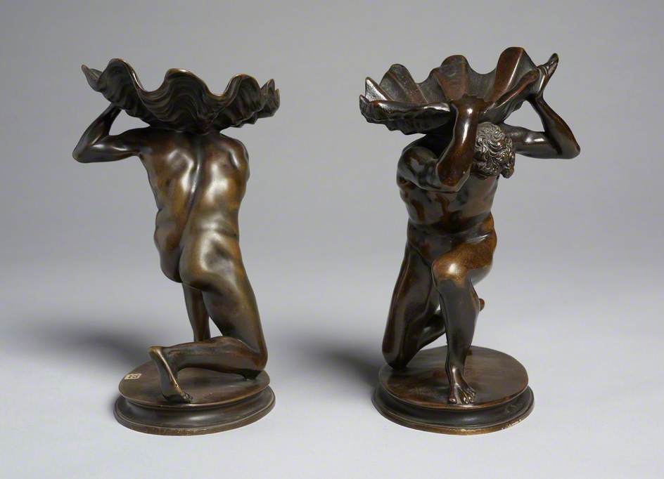 Pair of Kneeling Male Figures Holding Shells
