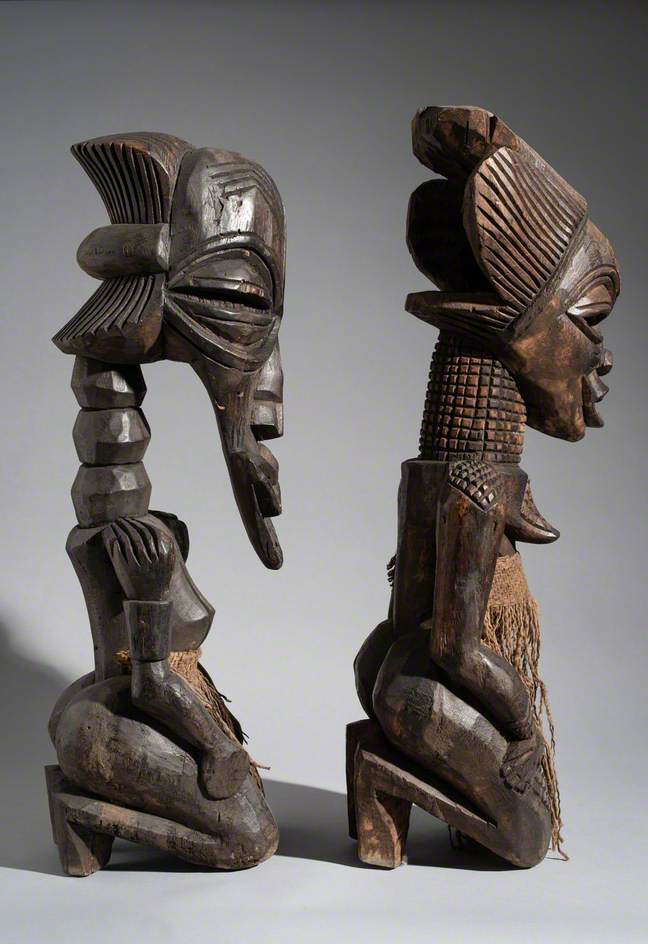 Pair of Traditional Sculptures of a Male and Female