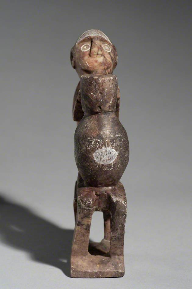 Figure of a Seated Man with a Pot