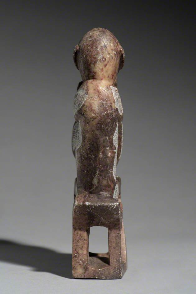 Figure of a Seated Man with a Pot