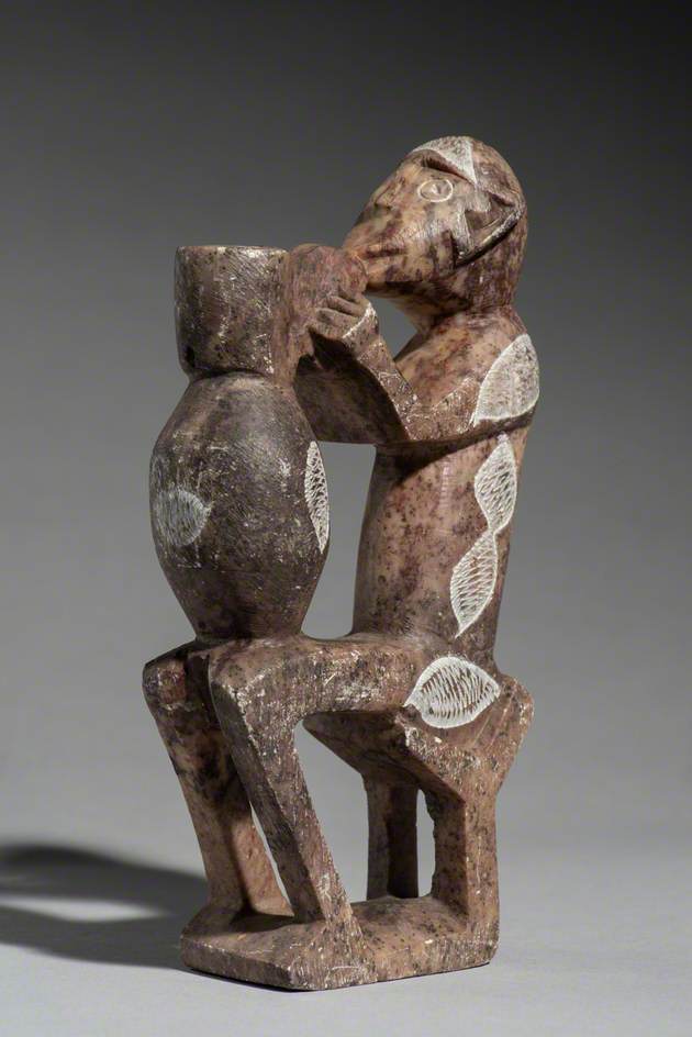 Figure of a Seated Man with a Pot